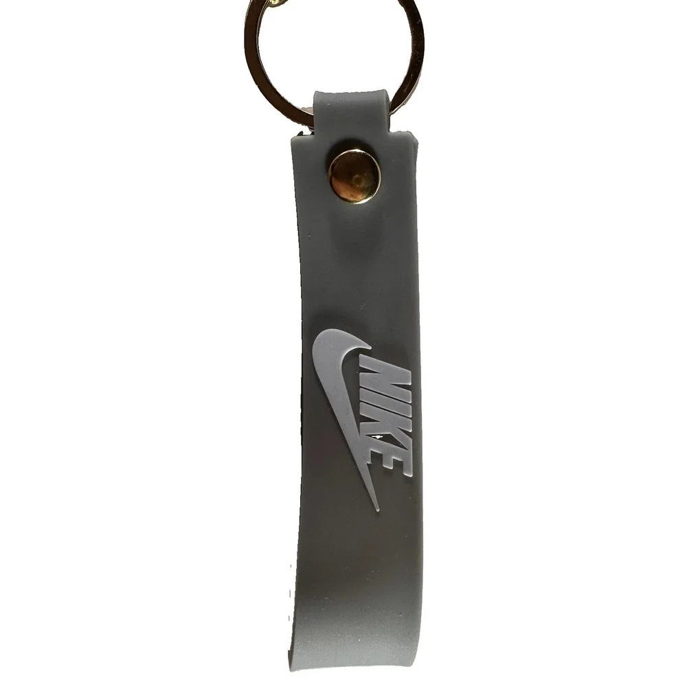 Grey & white miniature Nike Keychain styled like an Air Jordan wrist strap/bag